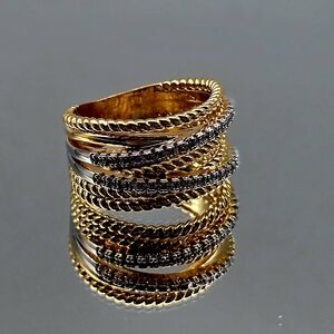 Elegant Gold and Silver Ring with Black Accents